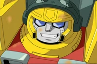He grins because he's too stupid to be sad.