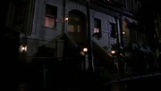 The exterior of Reyes' apartment at night.