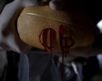 Blood drips from a teenager's blood-filled ball