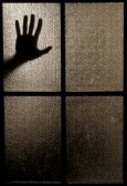 5645061-slightly-blurred-silhouette-of-a-hand-behind-a-window-or-glass-door-symbolizing-horror-or-fear.jpg